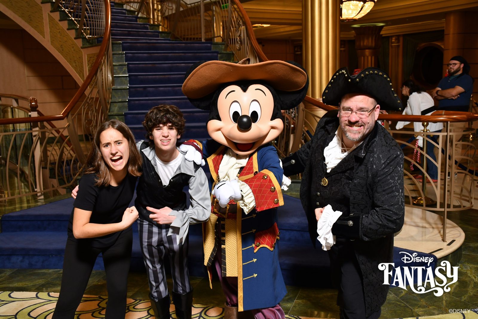 Lisa, Thomas, Mickey in pirate garb and Michael on Pirate Night in the Lobby Atrium