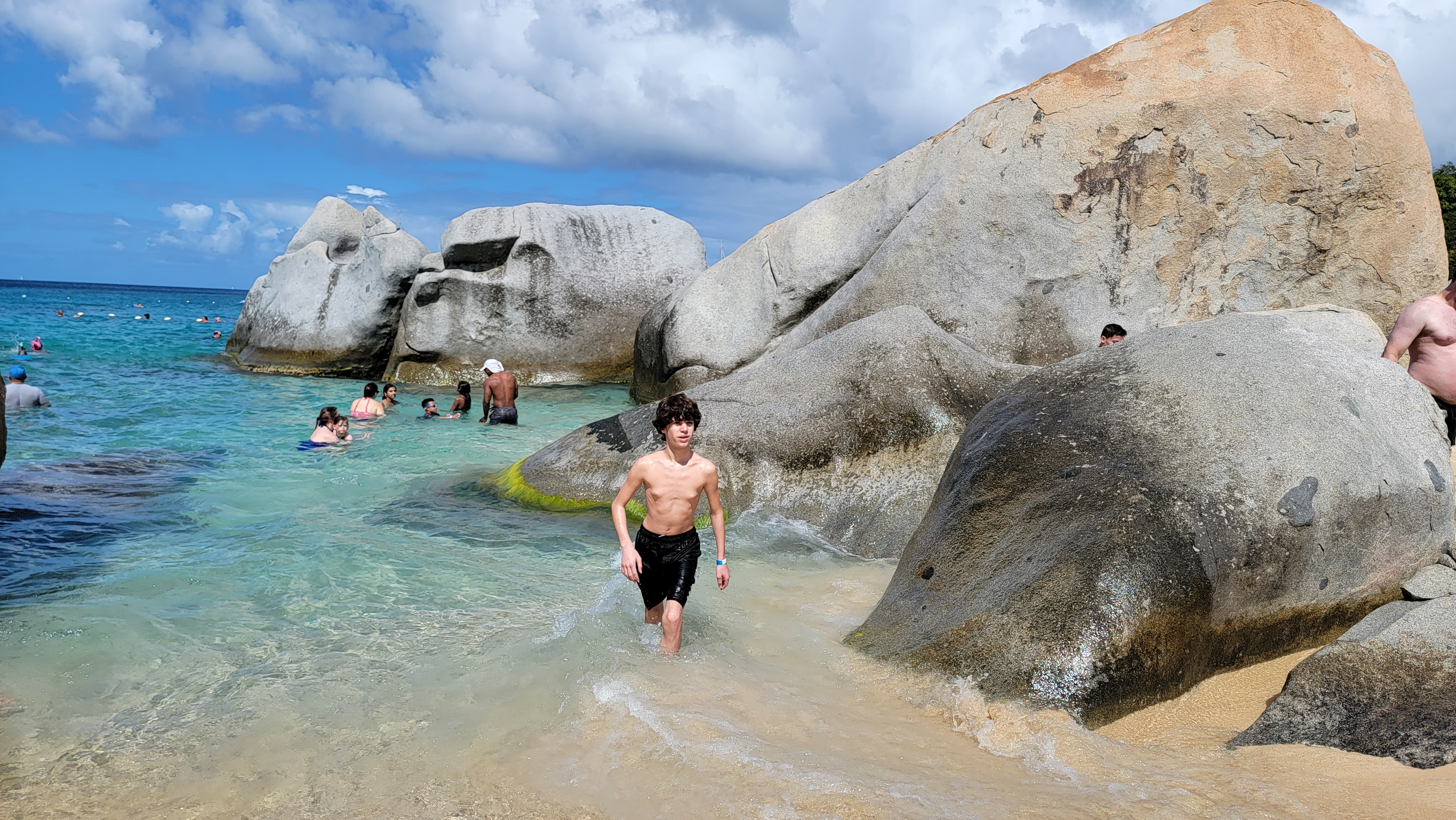 Thomas wading out over the rocks at The Baths