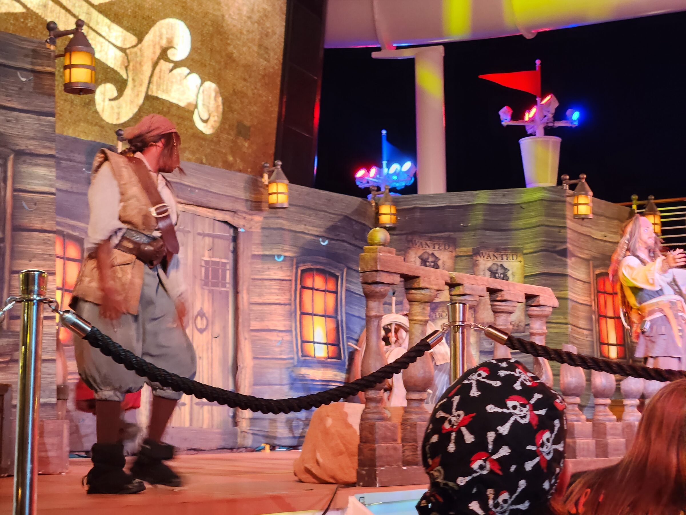 Pirates performing on stage at the Pirates in the Caribbean Deck Party