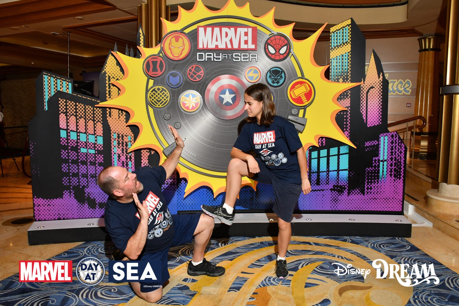Thomas and me clowning around at the Marvel backdrop