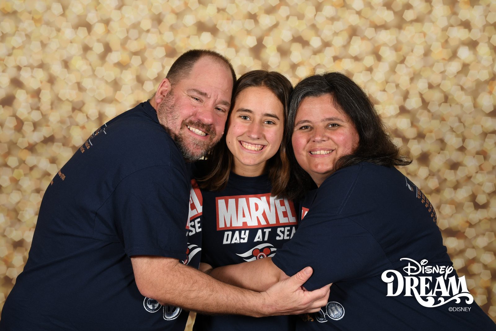 Michael, Lisa and Kathy in a big hug on the Disney Dream