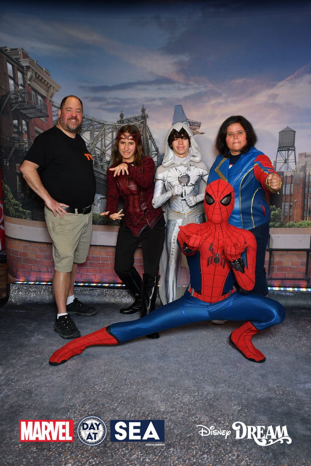 Michael, Lisa as Scarlet Witch, Thomas as Moon Knight and Kathy as Ms. Marvel with Spider-Man on Marvel Day at Sea