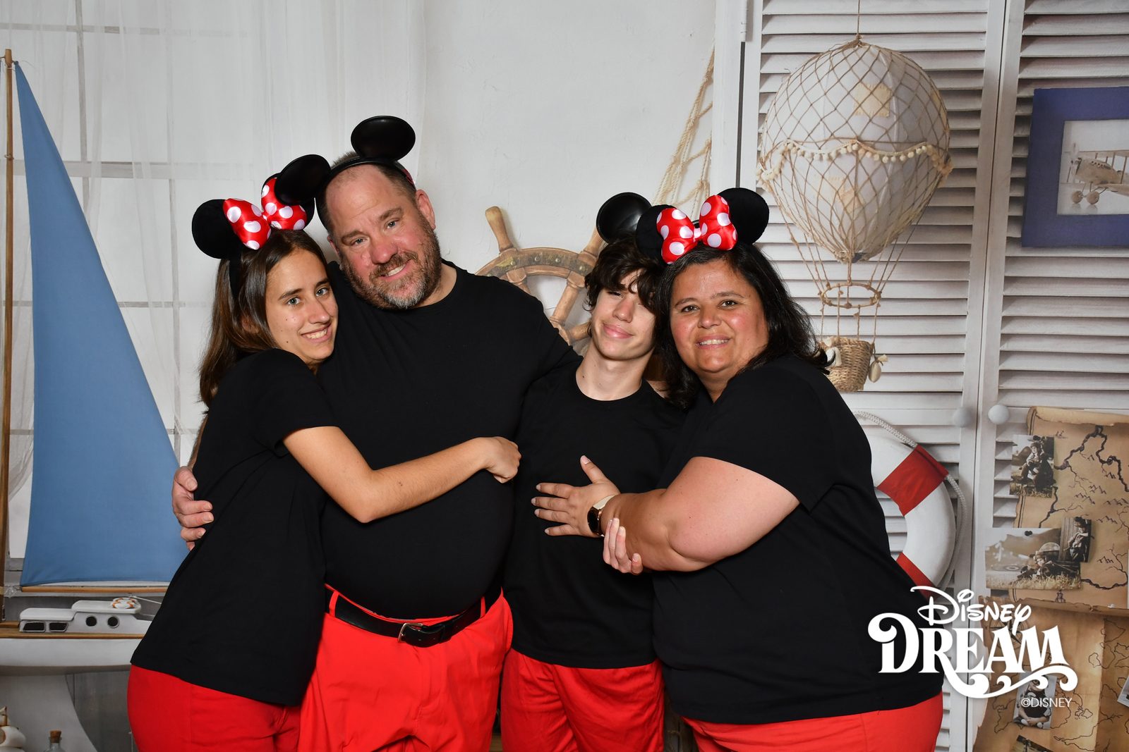 Family portrait in mouse ears at Shutters