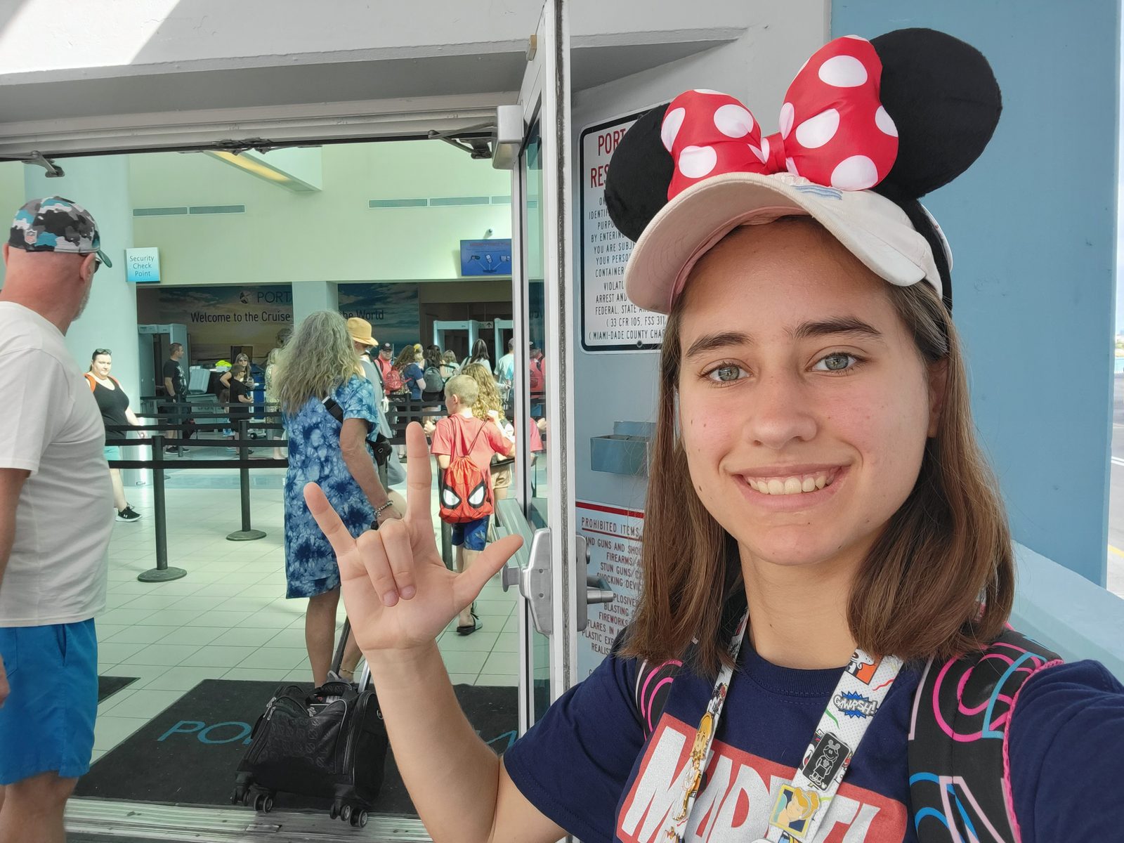 Lisa signs I love you at check-in