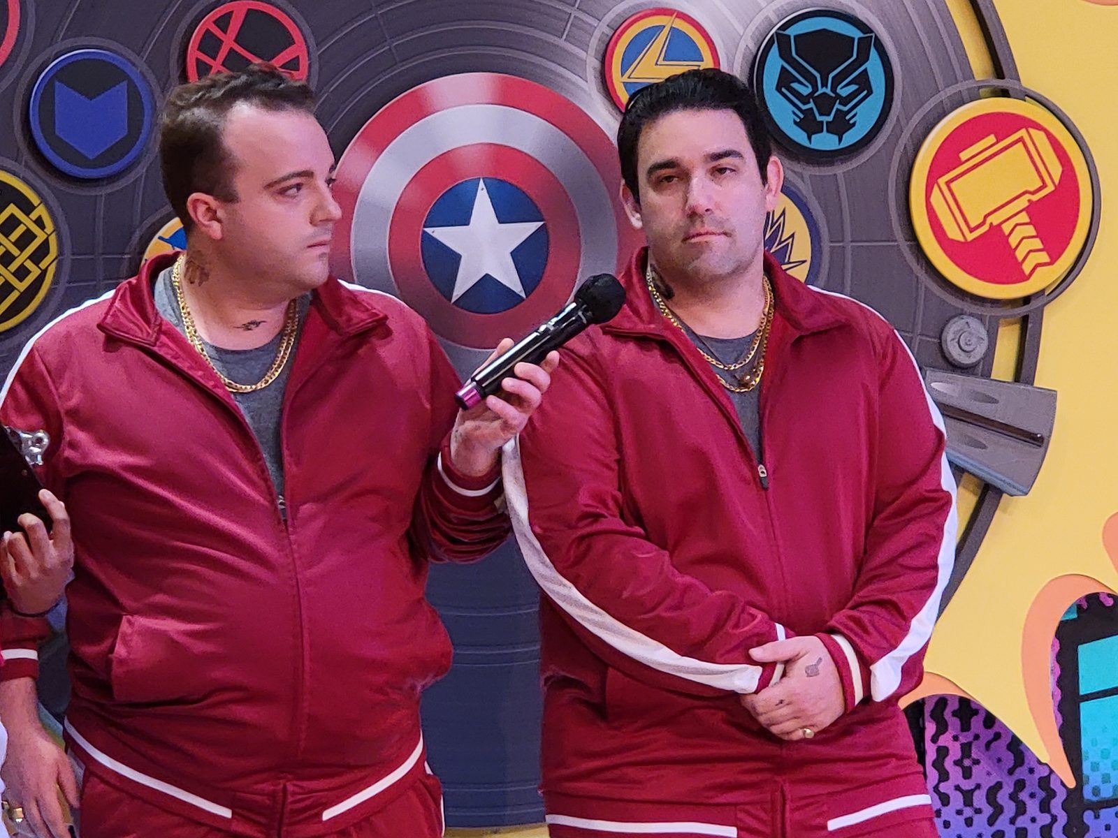 Pulled on stage in a matching red tracksuit