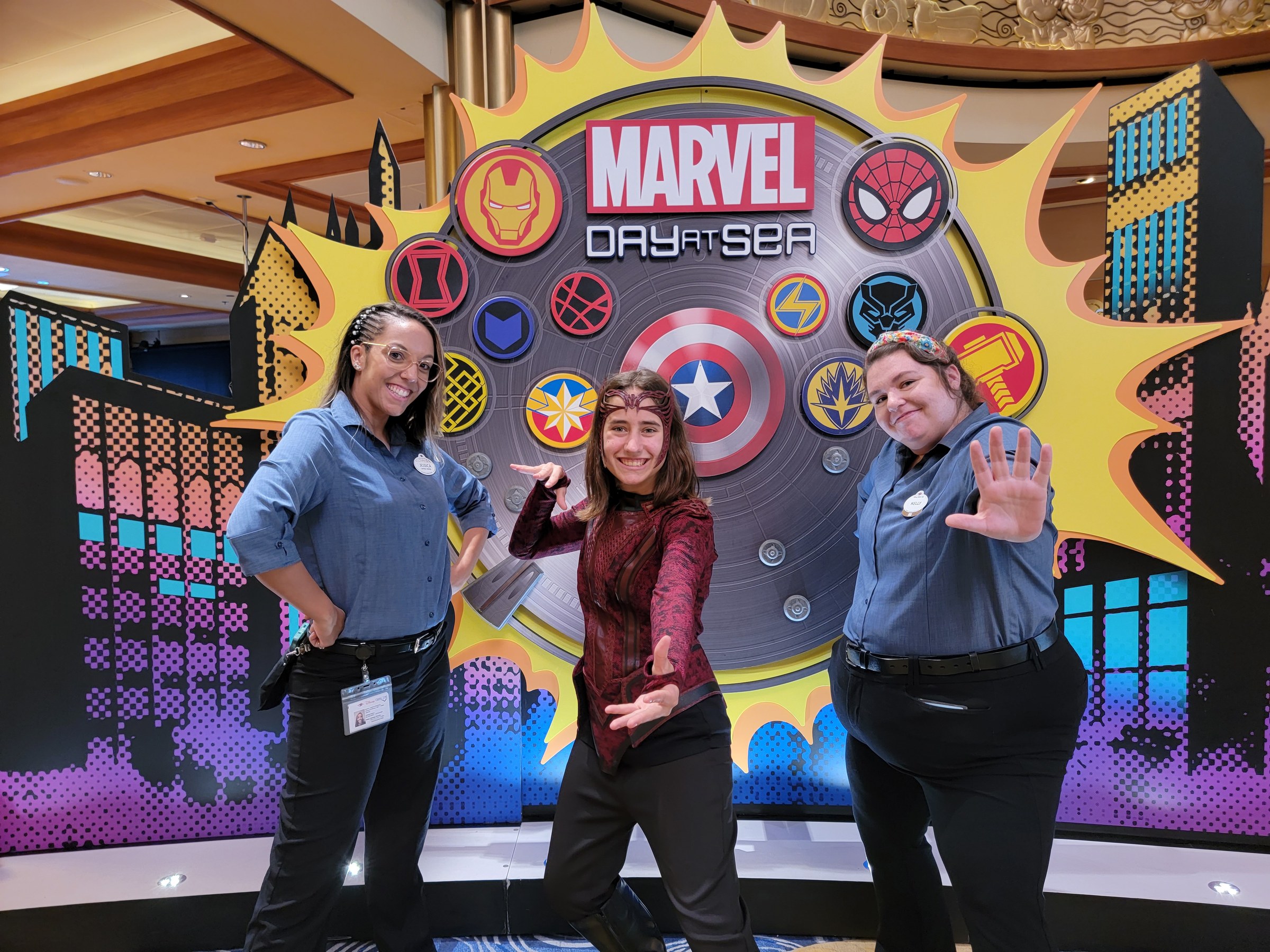 Lisa strikes a pose between our ASL interpreters Jessica and Kelly on Marvel Day at Sea
