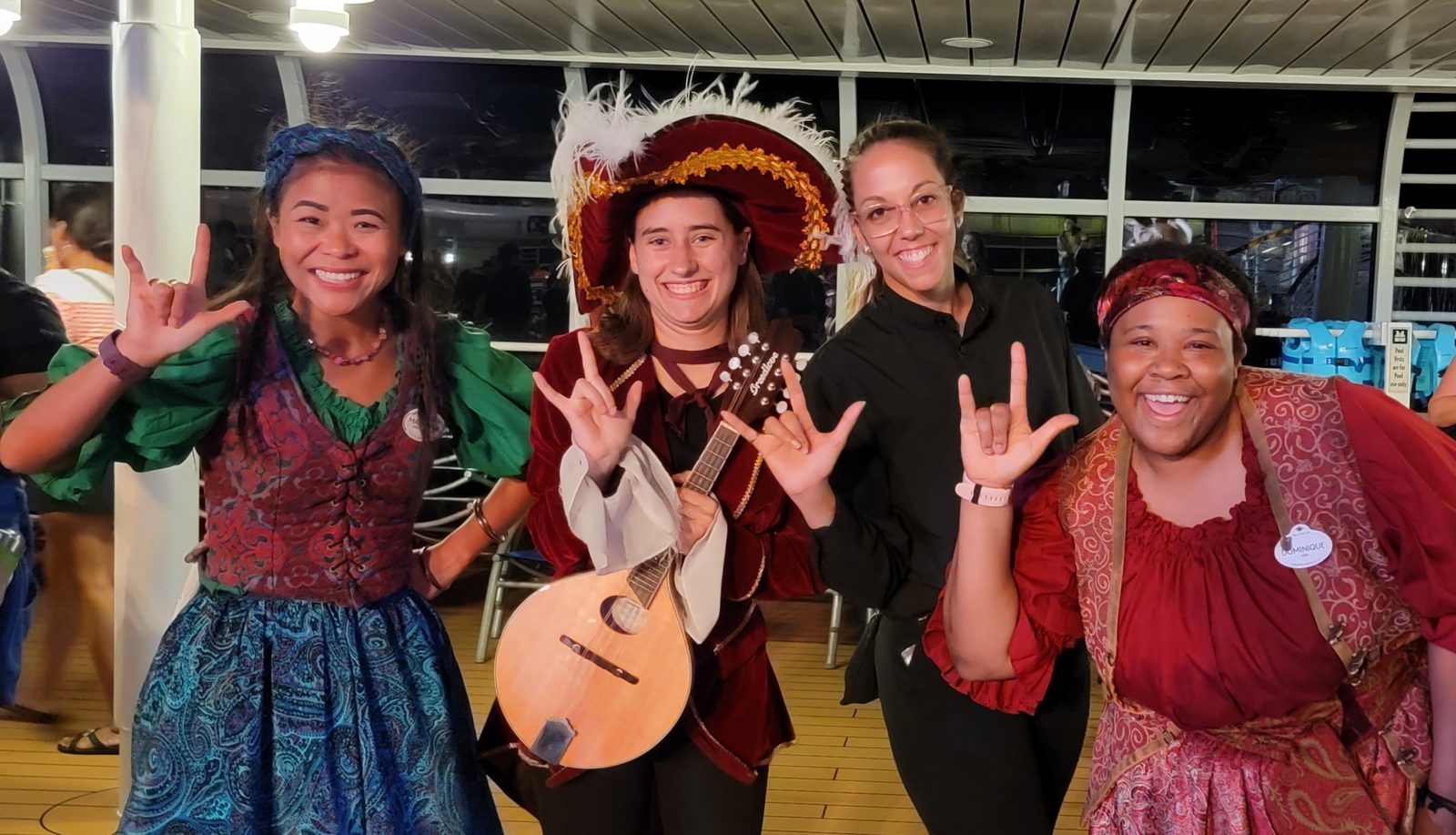 Marianna, Lisa, Jessica and Dominique on deck sign I love you on Pirate Night