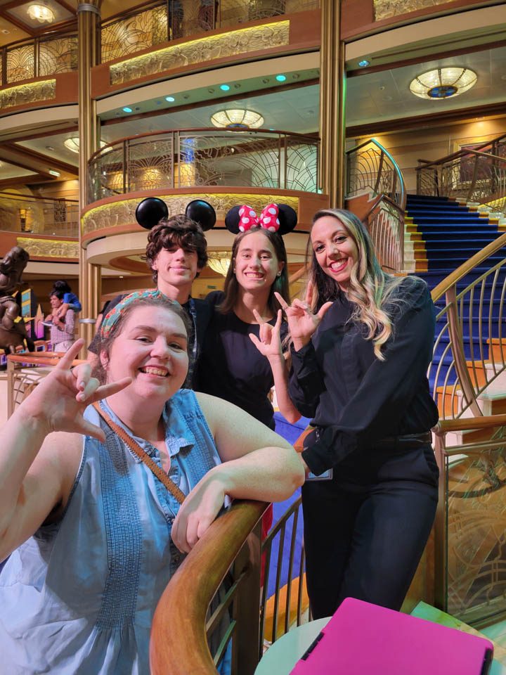Thomas and Lisa with Jessica and Kelly, two of the ship's ASL interpreters, on the staircase