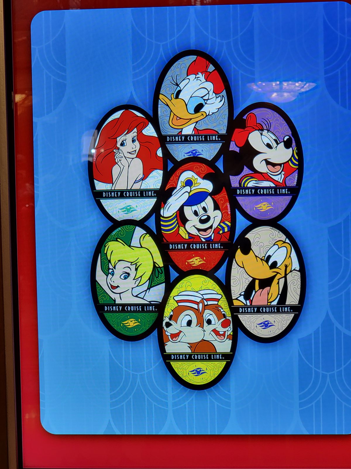 Our Castaway Club pins from the cruise
