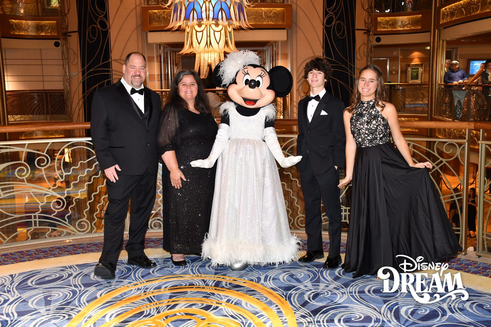 Michael, Kathy, Minnie in her white formal gown, Thomas and Lisa on Formal Night in the Lobby Atrium