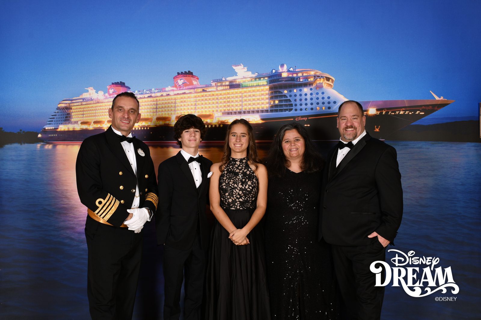 Portraits with the ship lit up behind us