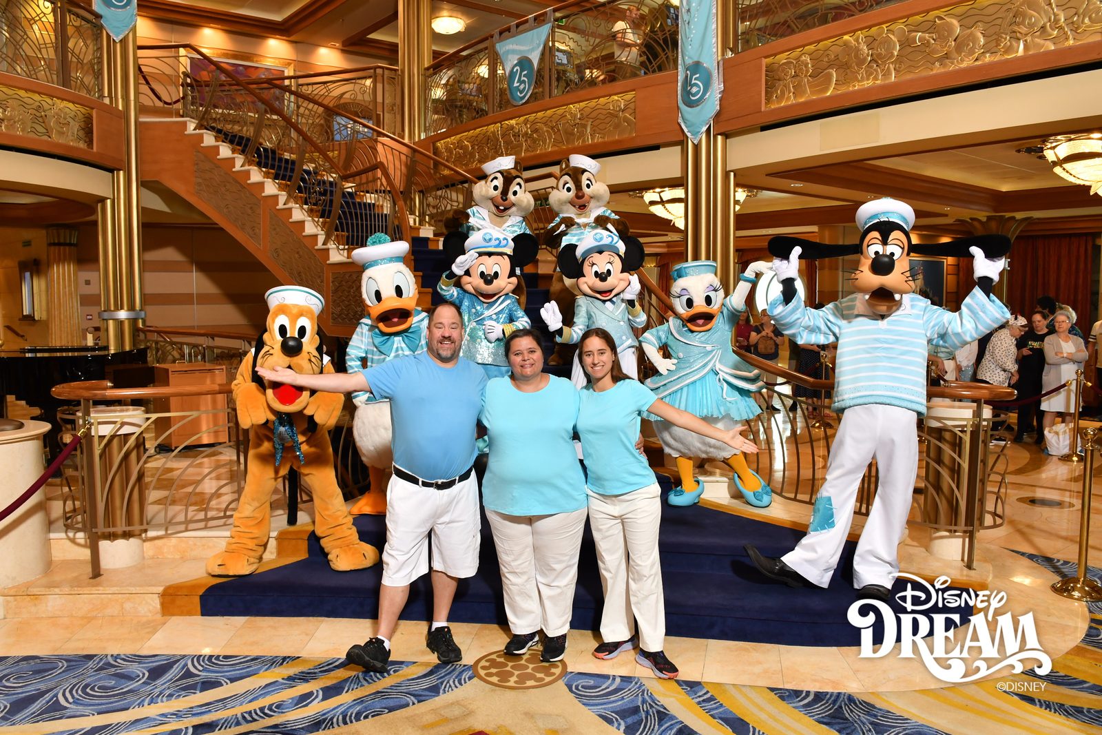 Pluto, Donald, Mickey, Chip, Dale, Daisy, Minnie and Goofy in their Silver Anniversary outfits with Michael, Kathy and Lisa in the Lobby Atrium