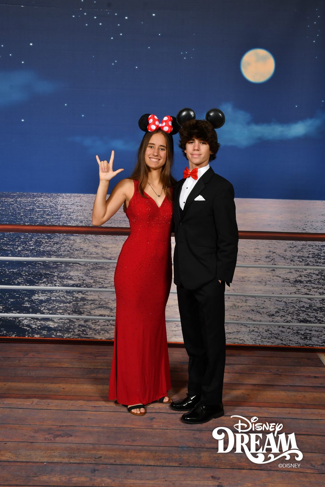 Lisa and Thomas at the moon backdrop on the Disney Dream