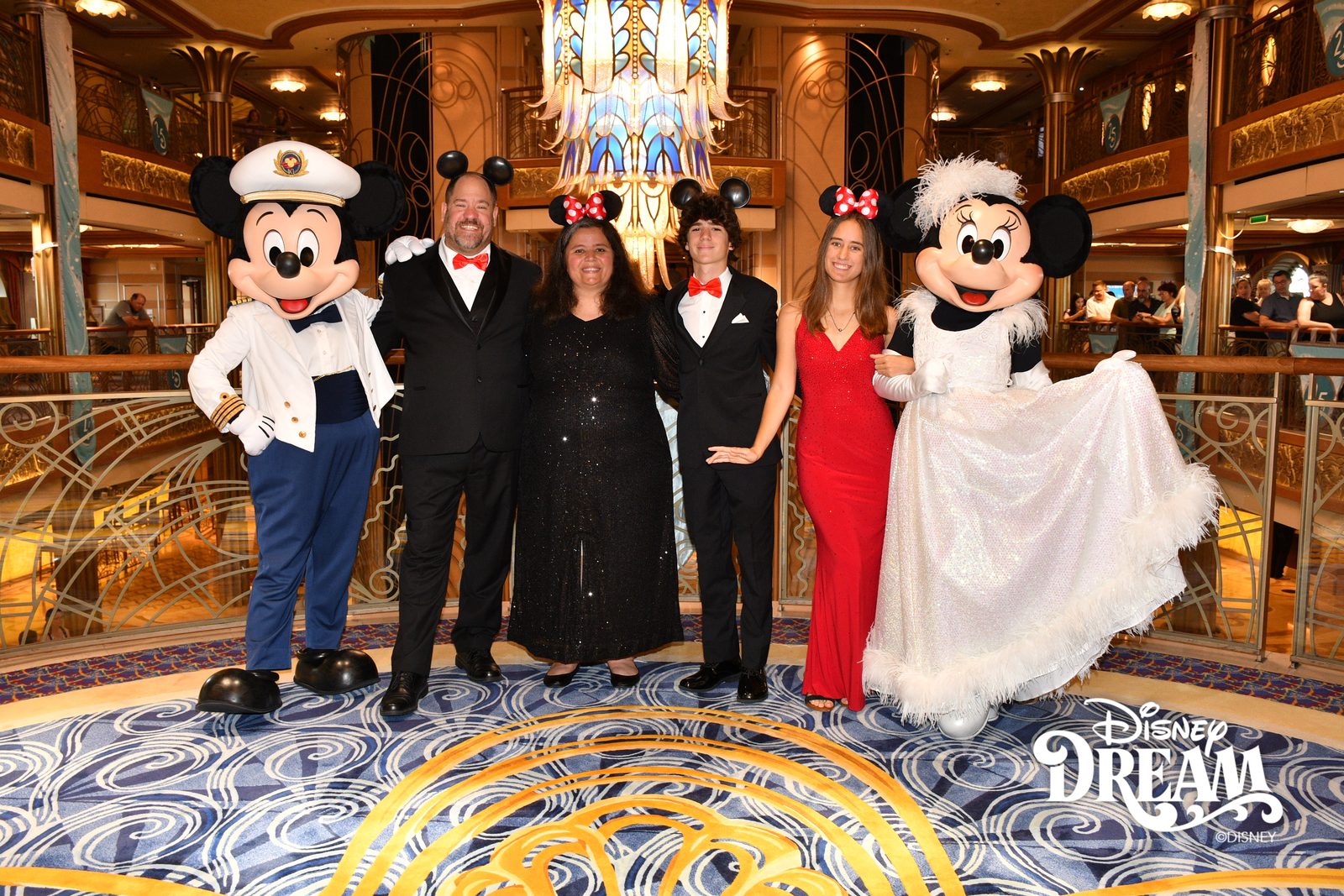 Captain Mickey, Michael, Kathy, Thomas, Lisa and Minnie in her white formal gown in the Lobby Atrium