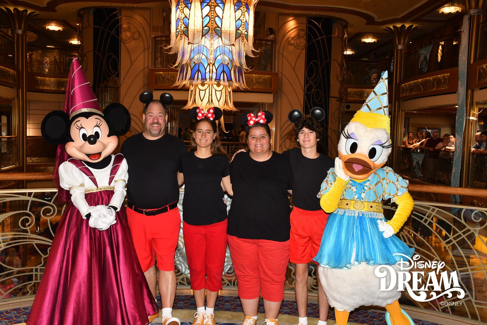 Minnie in her princess gown, Michael, Lisa, Kathy, Thomas and Daisy in her princess gown in the Lobby Atrium