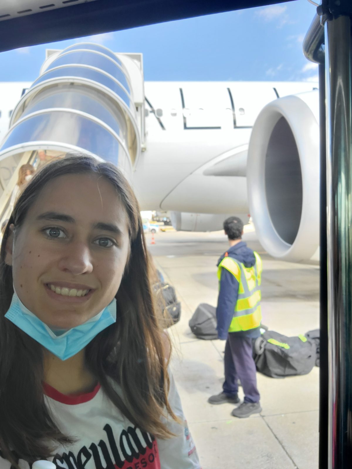 Lisa by the plane at Lisbon airport