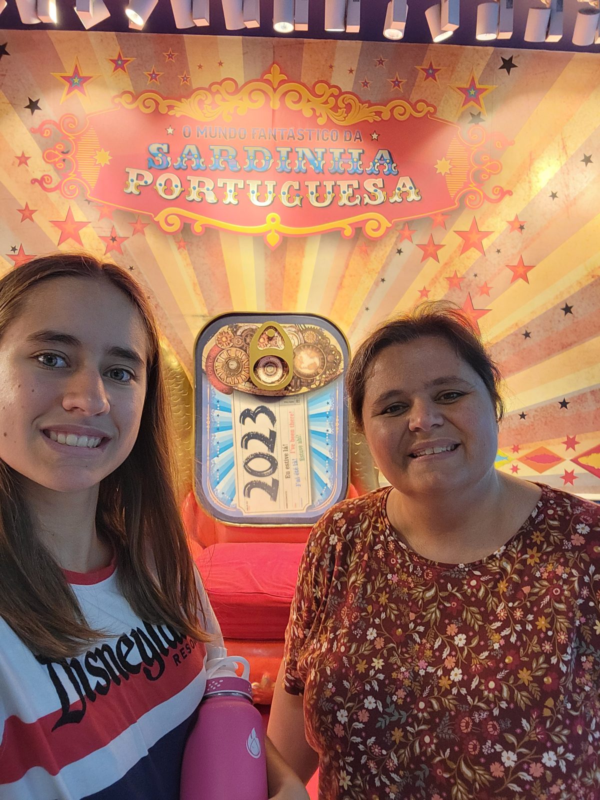 Lisa and Kathy at a Lisbon airport display