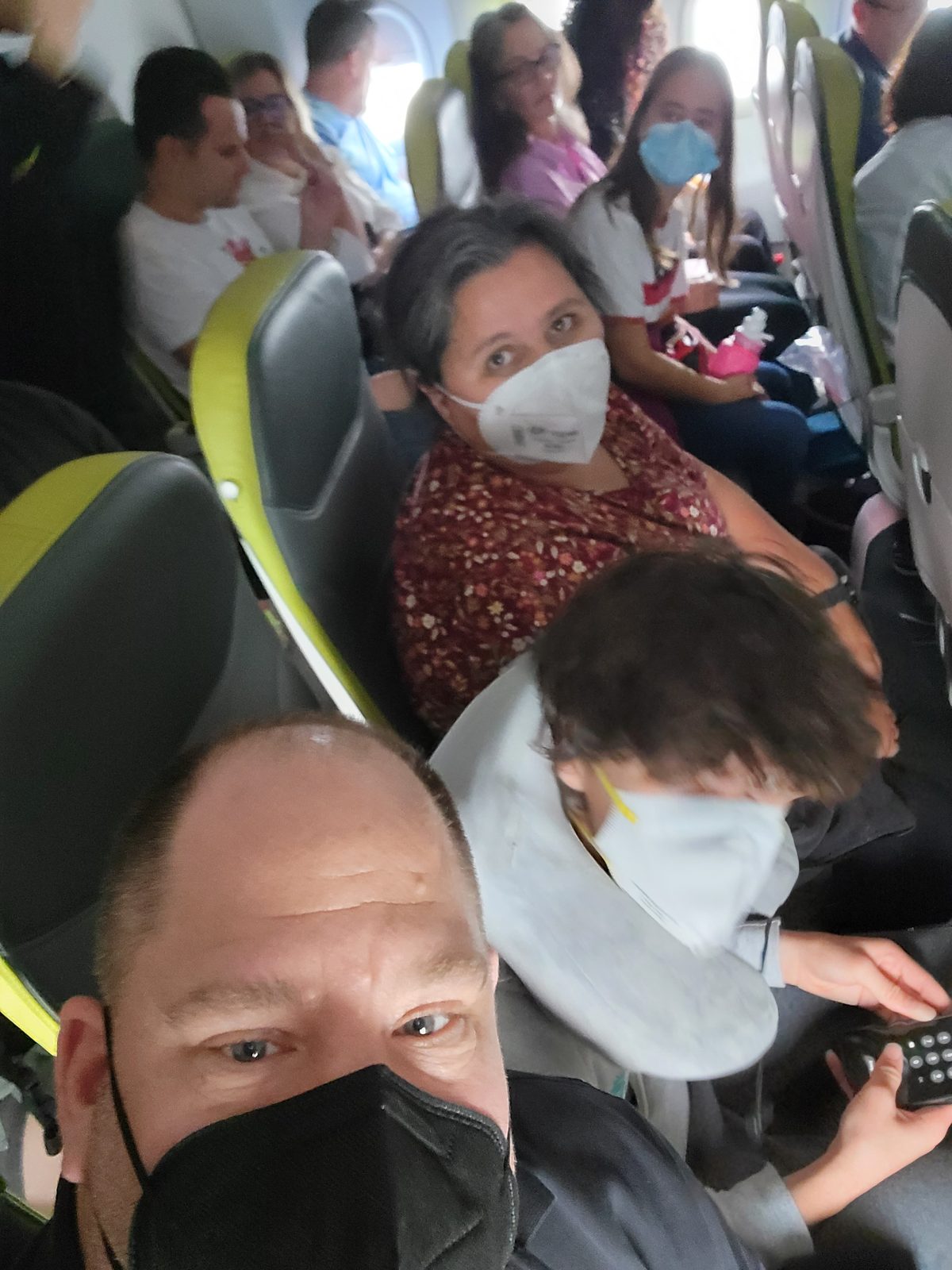 Masked up for the flight to Heathrow
