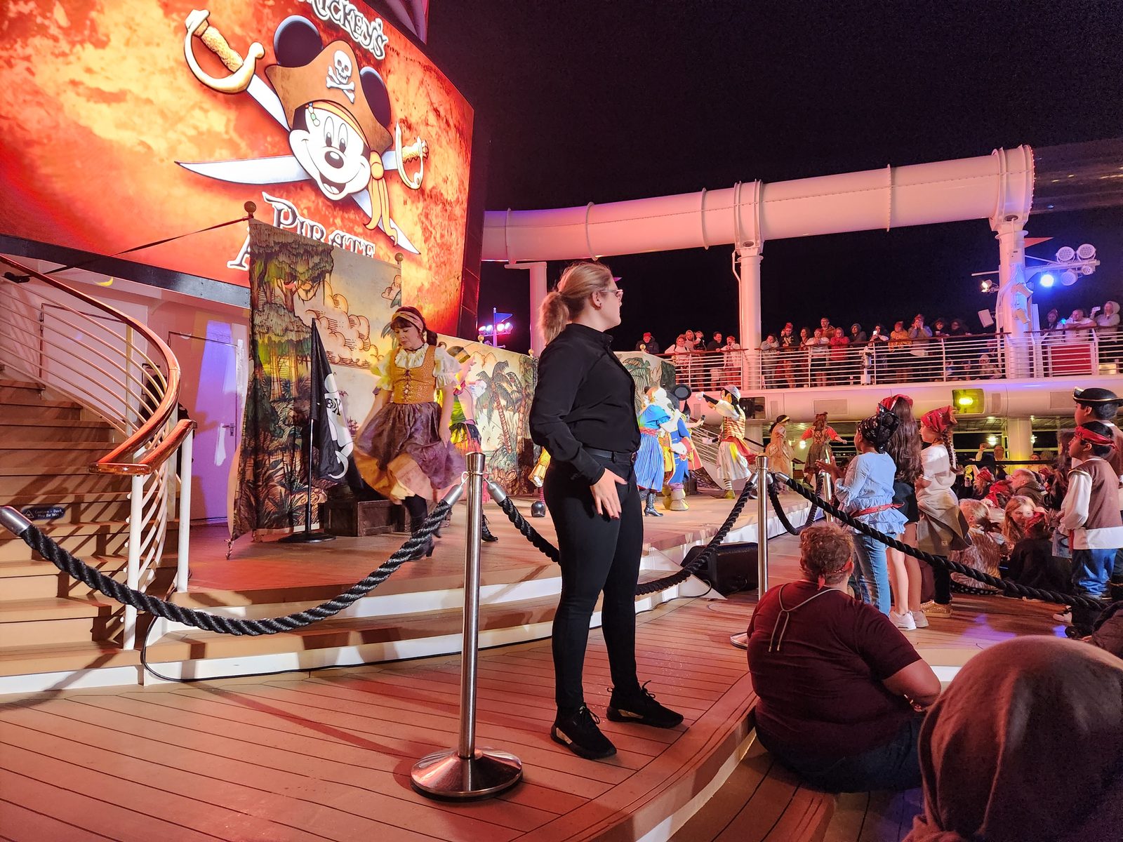 Jenna signing Mickey's Pirates in the Caribbean deck party on Pirate Night