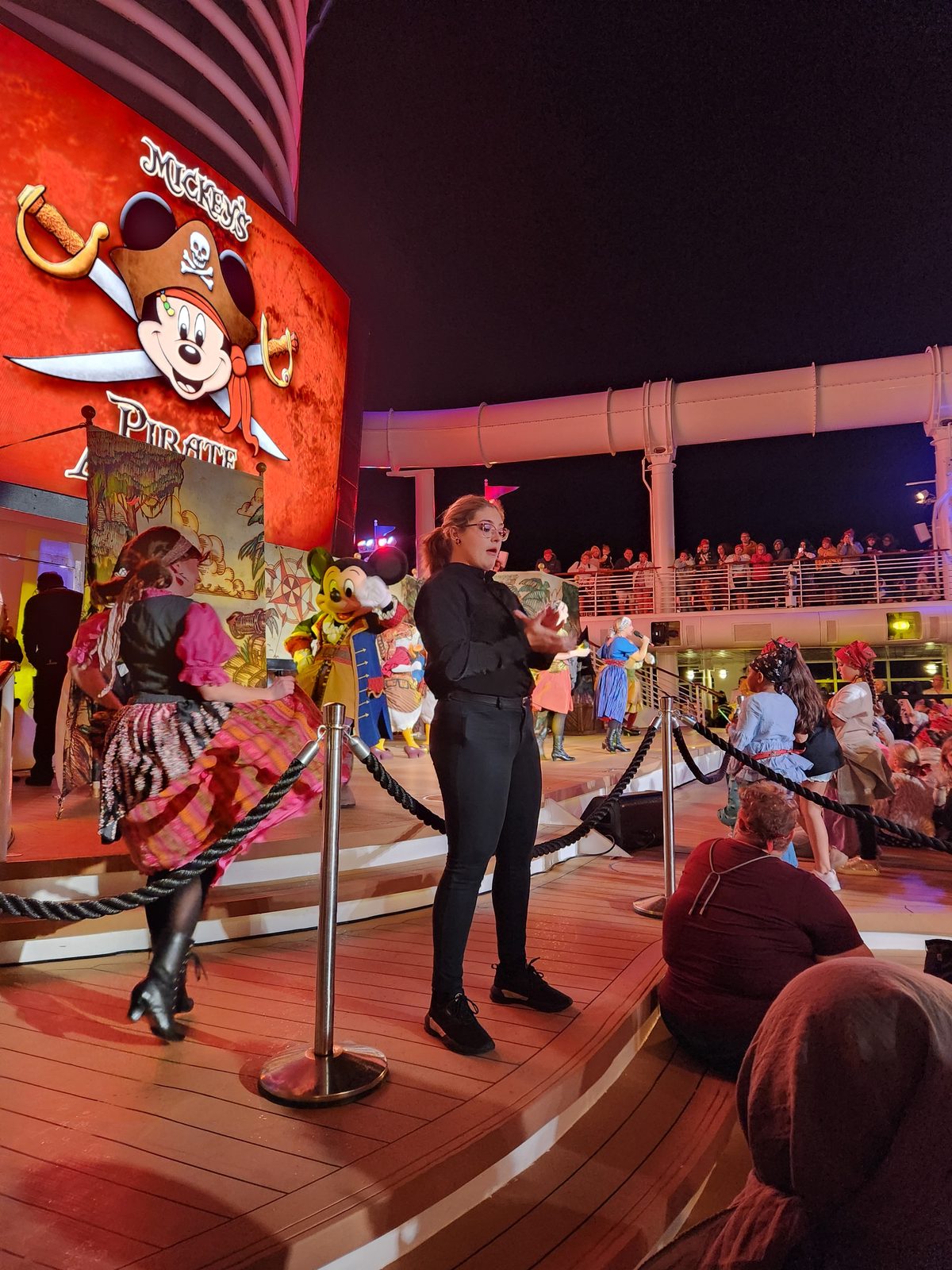 Jenna signing Mickey's Pirates in the Caribbean deck party on Pirate Night