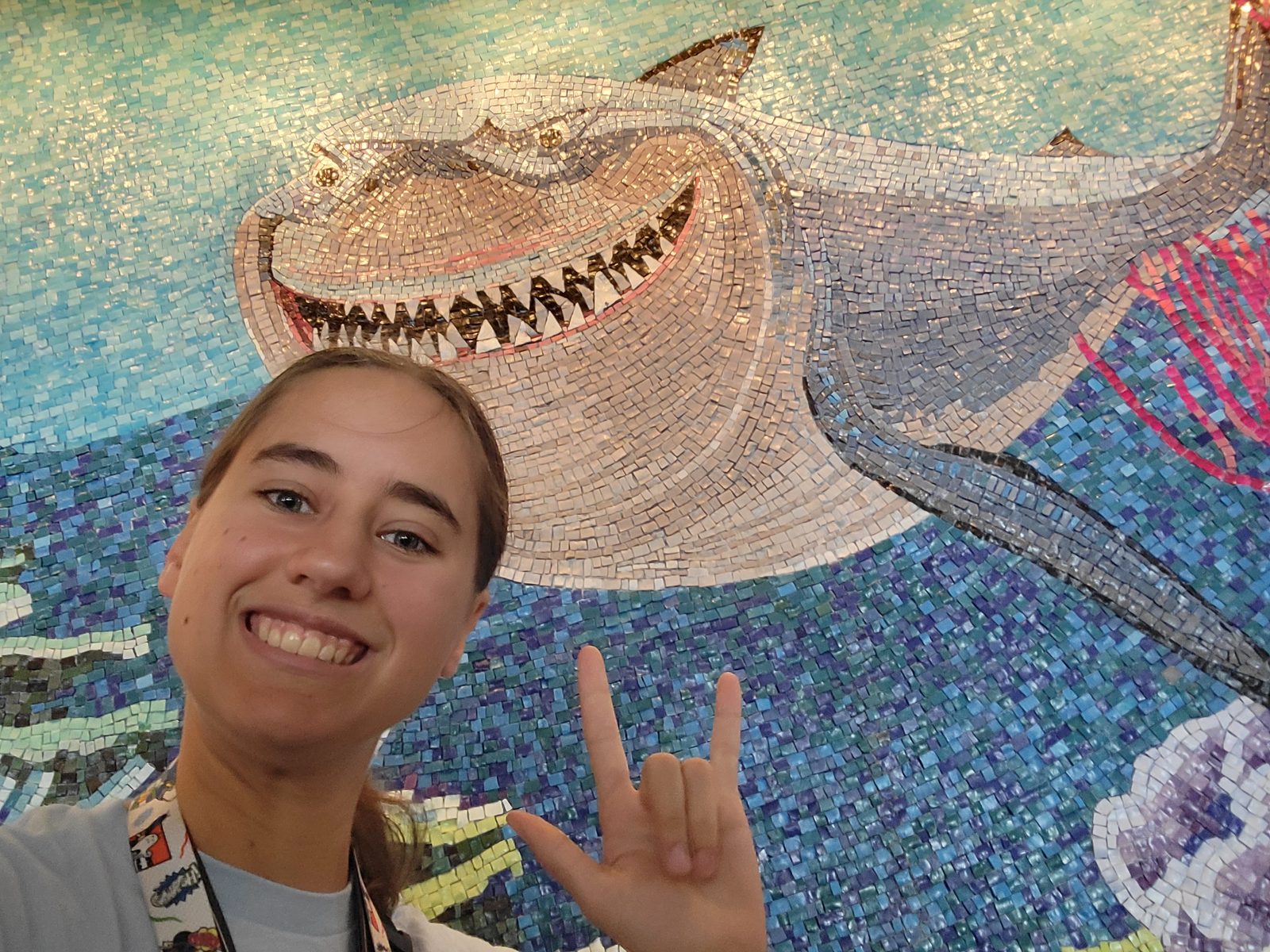 Lisa signs I love you at the shark mosaic