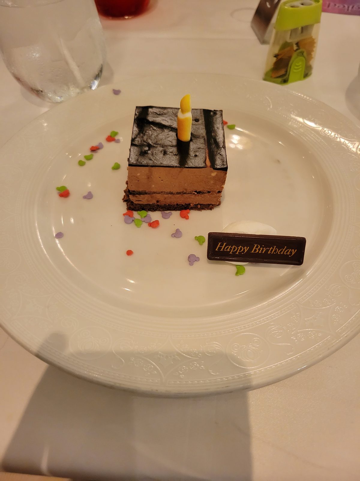 A birthday cake arrives at dinner