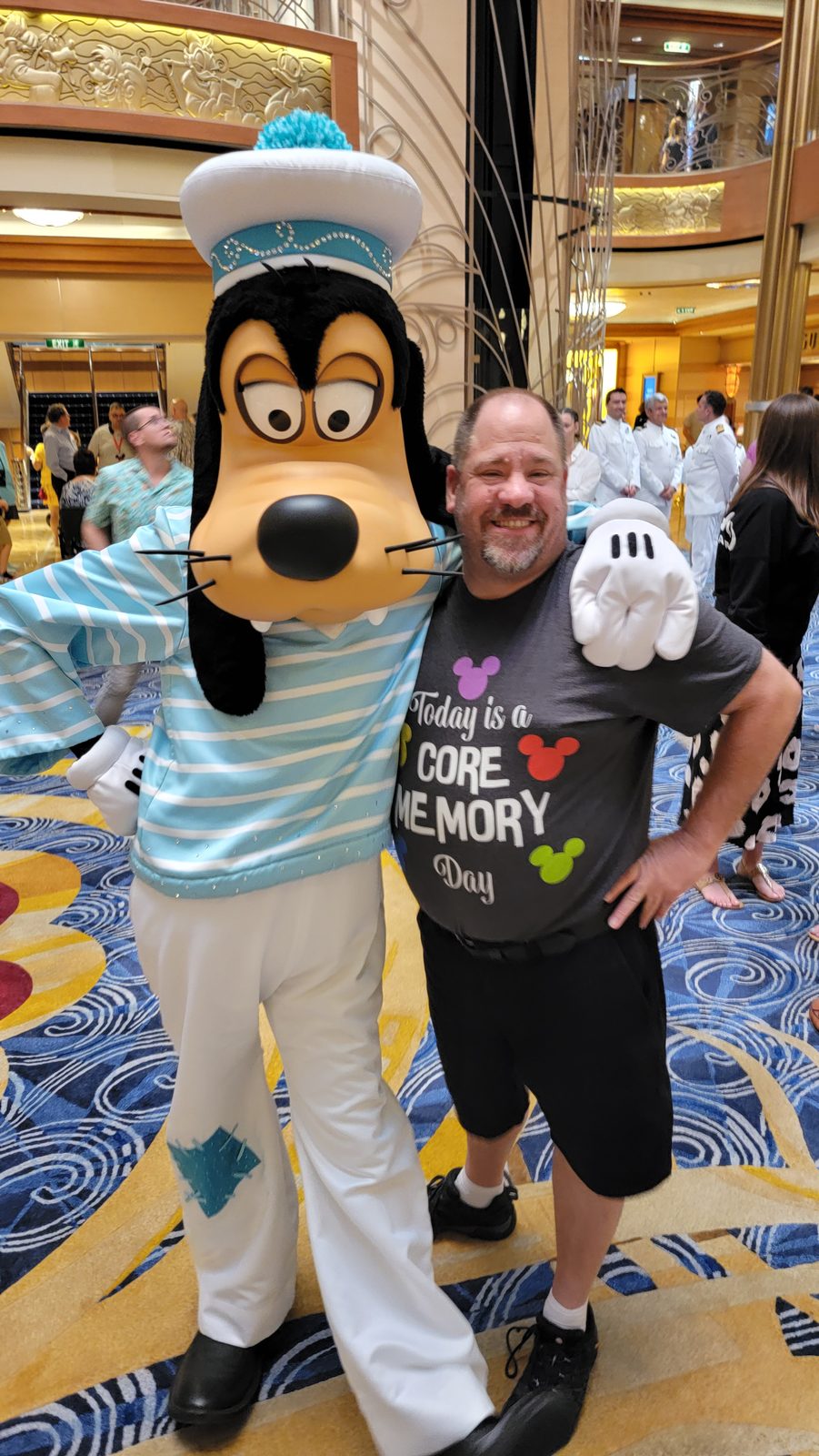 Goofy in his Silver Anniversary outfit with Michael in his Core Memory Day shirt