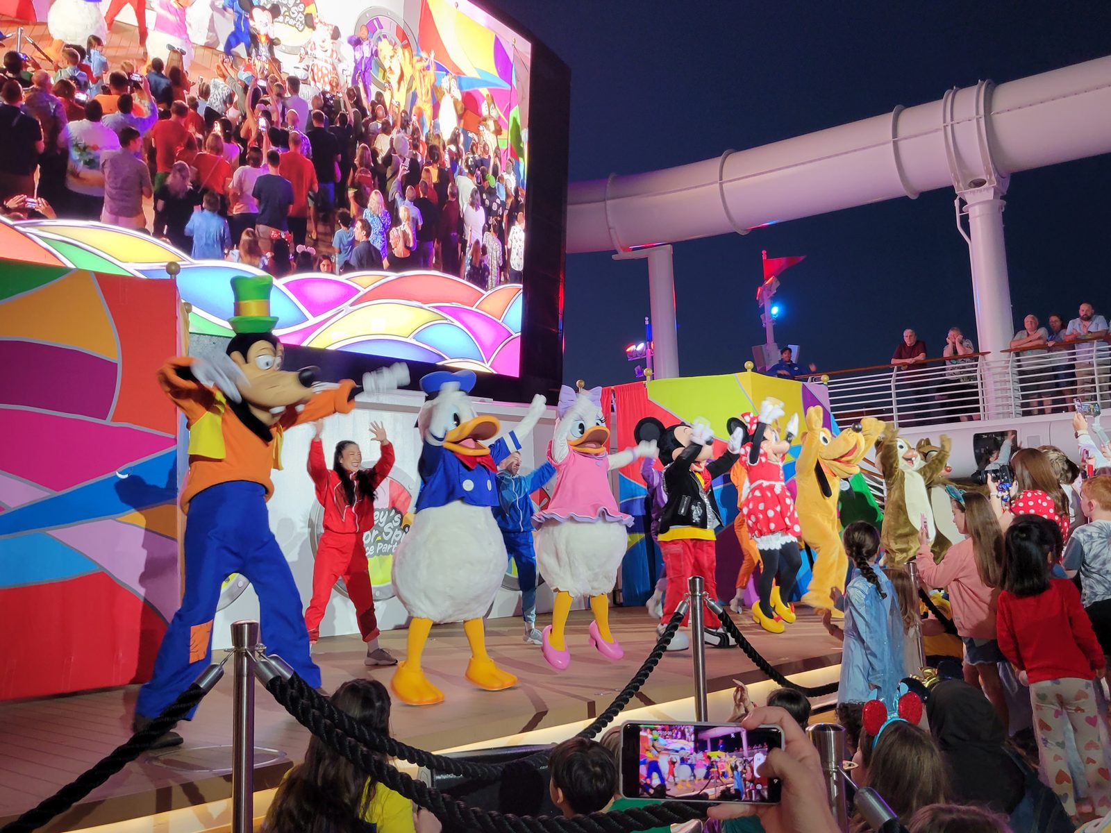 Goofy, Donald, Daisy, Minnie, Mickey and Pluto in their Color Spin outfits at Mickey's Color Spin Dance Party