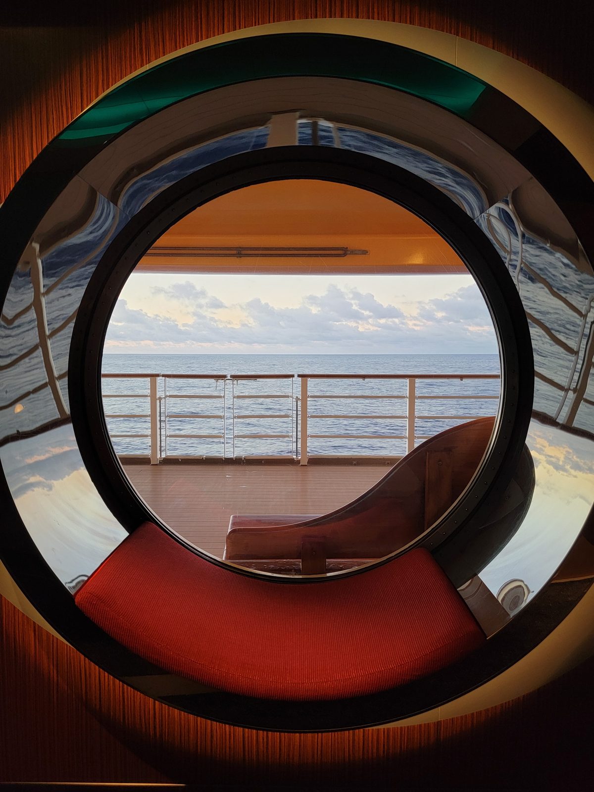 Porthole view over an empty sea