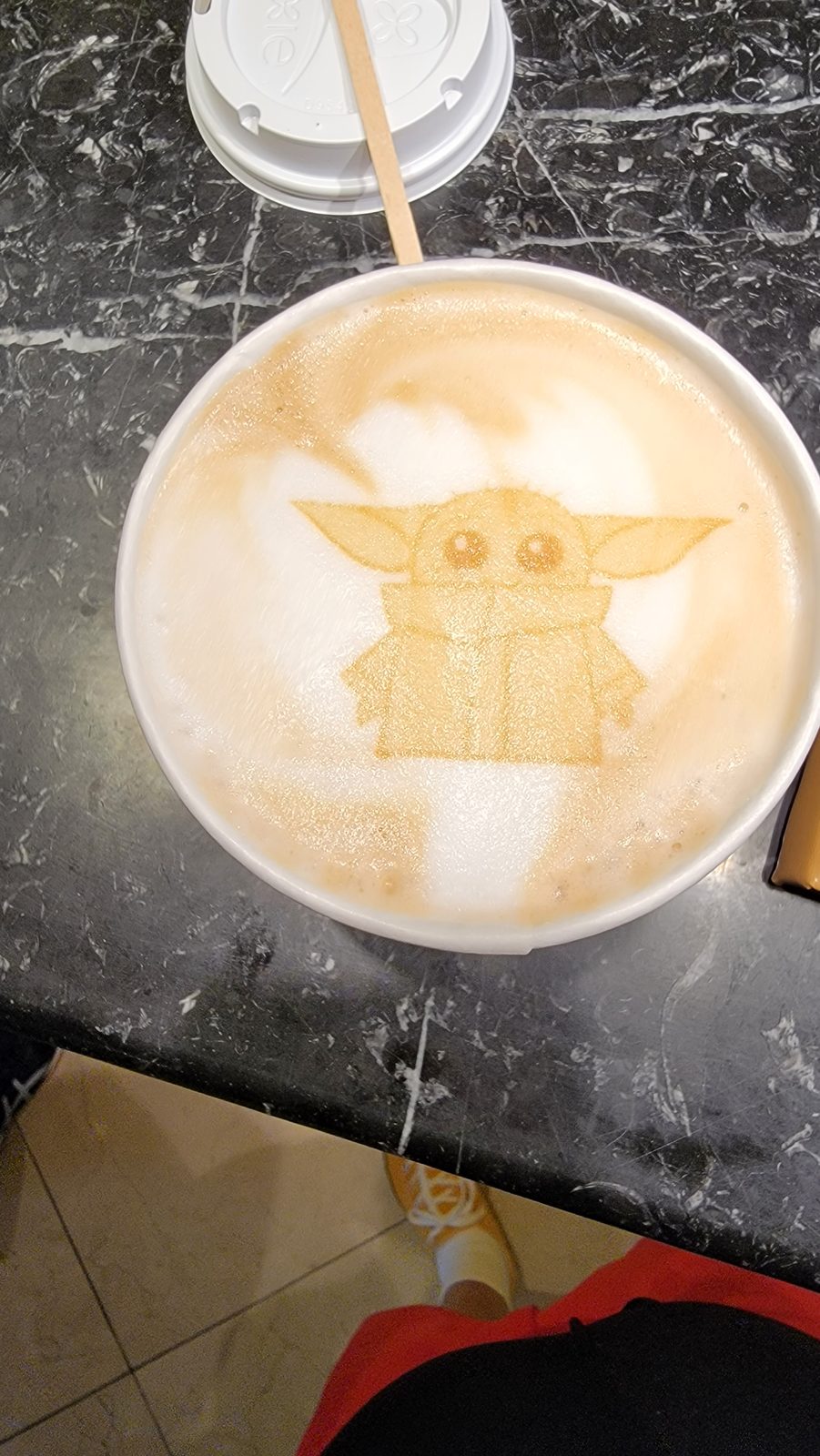 Grogu in the coffee foam on the Disney Dream