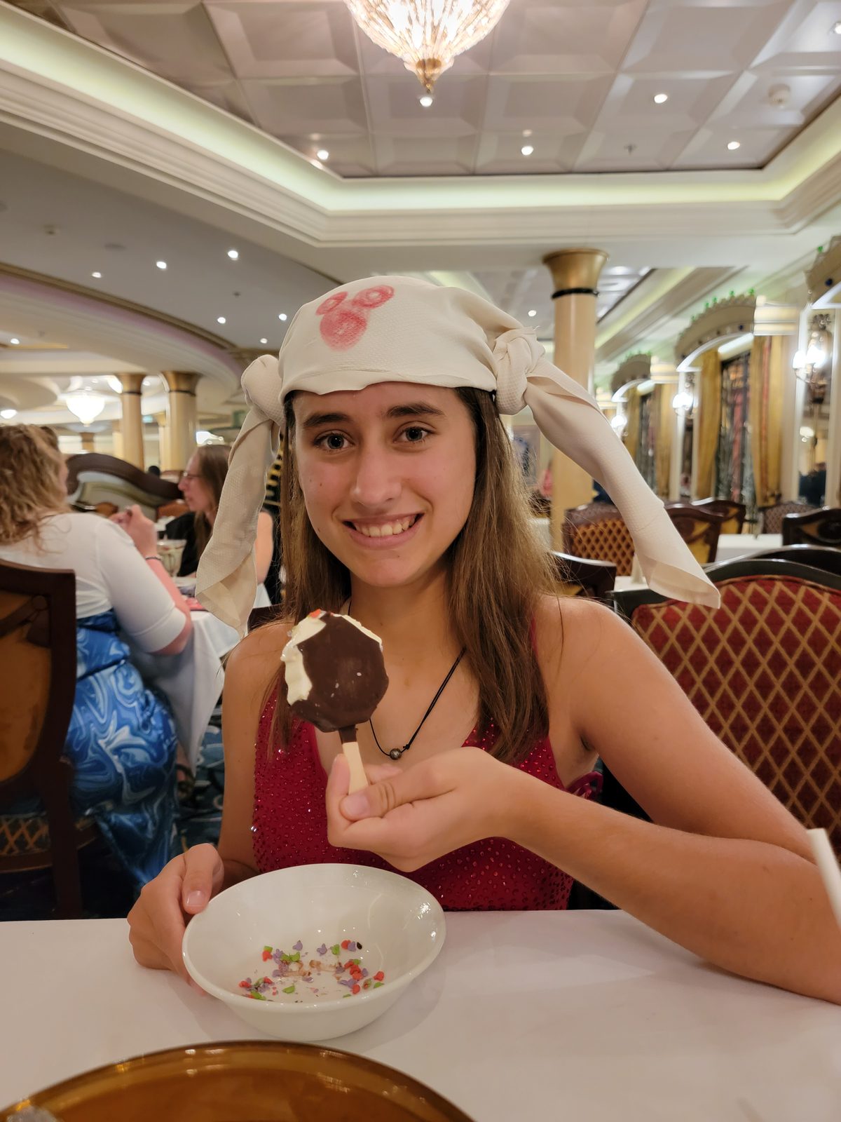 Lisa's napkin folded into ears