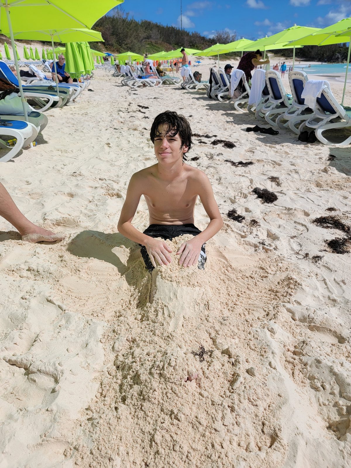 Thomas digging into the pink sand