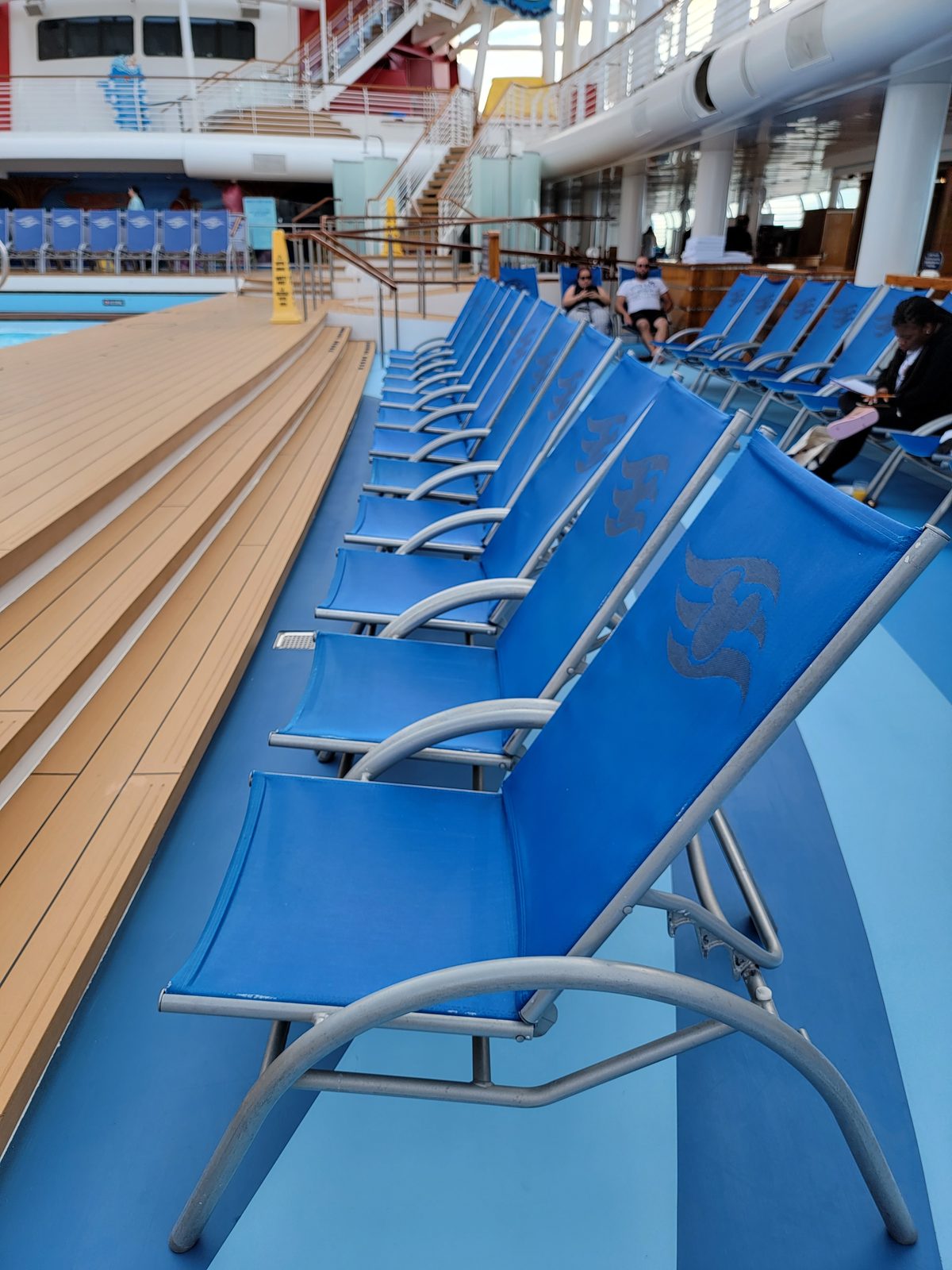 Empty loungers on the pool deck