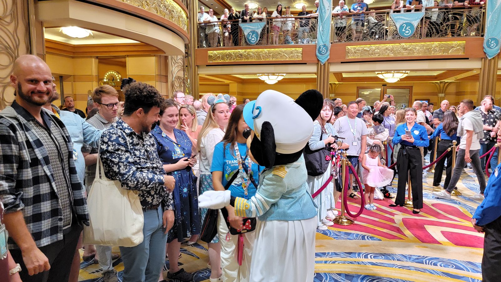 Lisa and Deaf friends from France meeting Minnie in her Silver Anniversary outfit in the Lobby Atrium