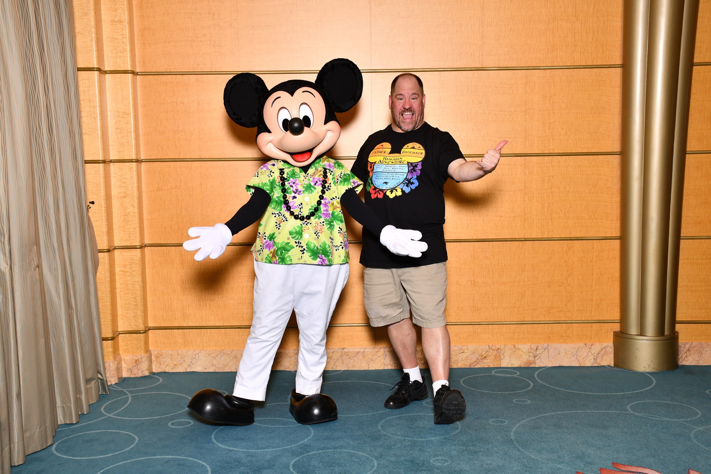 Mickey in his aloha shirt and lei & Michael