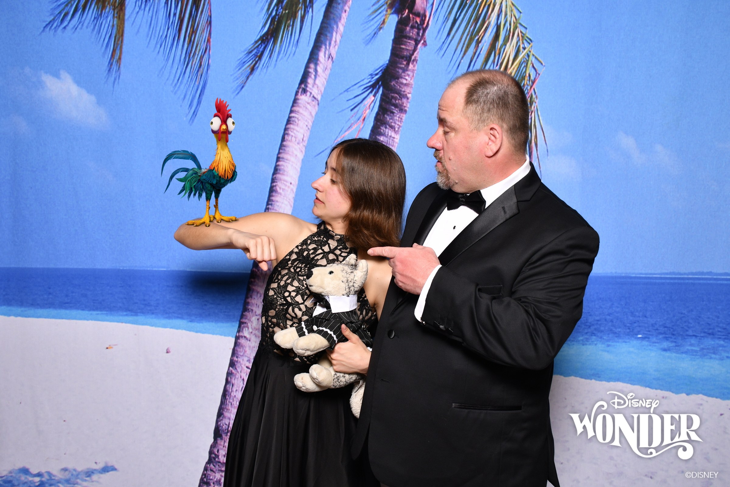 Lisa, Bob and Michael with a Magic Shot Hei Hei, dressed for Palo