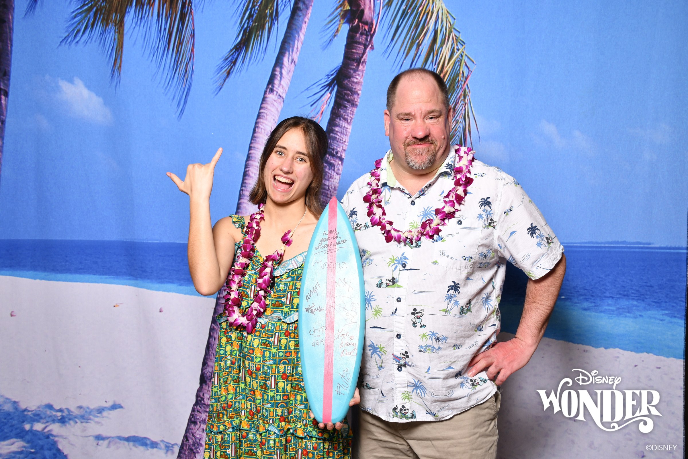 Lisa and Michael at the beach backdrop in our leis