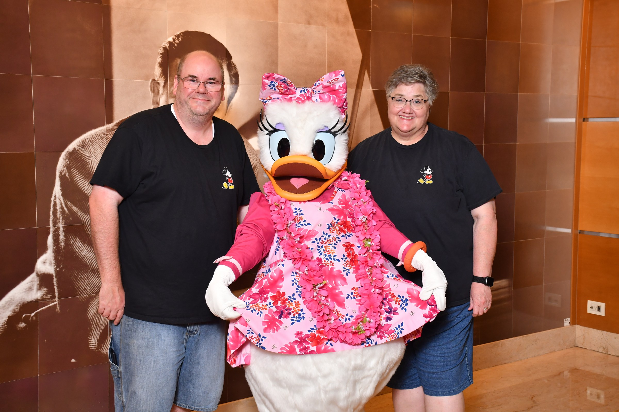 Daisy Duck in her aloha outfit with Loren and a friend