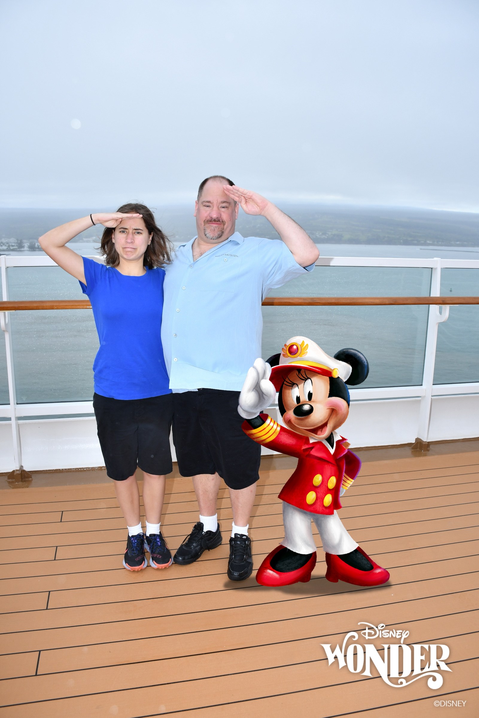 Lisa and Michael saluting a Magic Shot Captain Minnie at Hilo