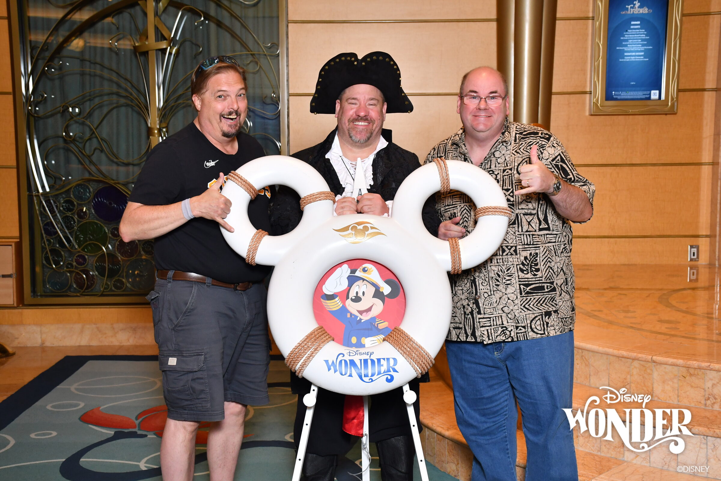 Michael in his pirate coat with two friends at the pirate life ring