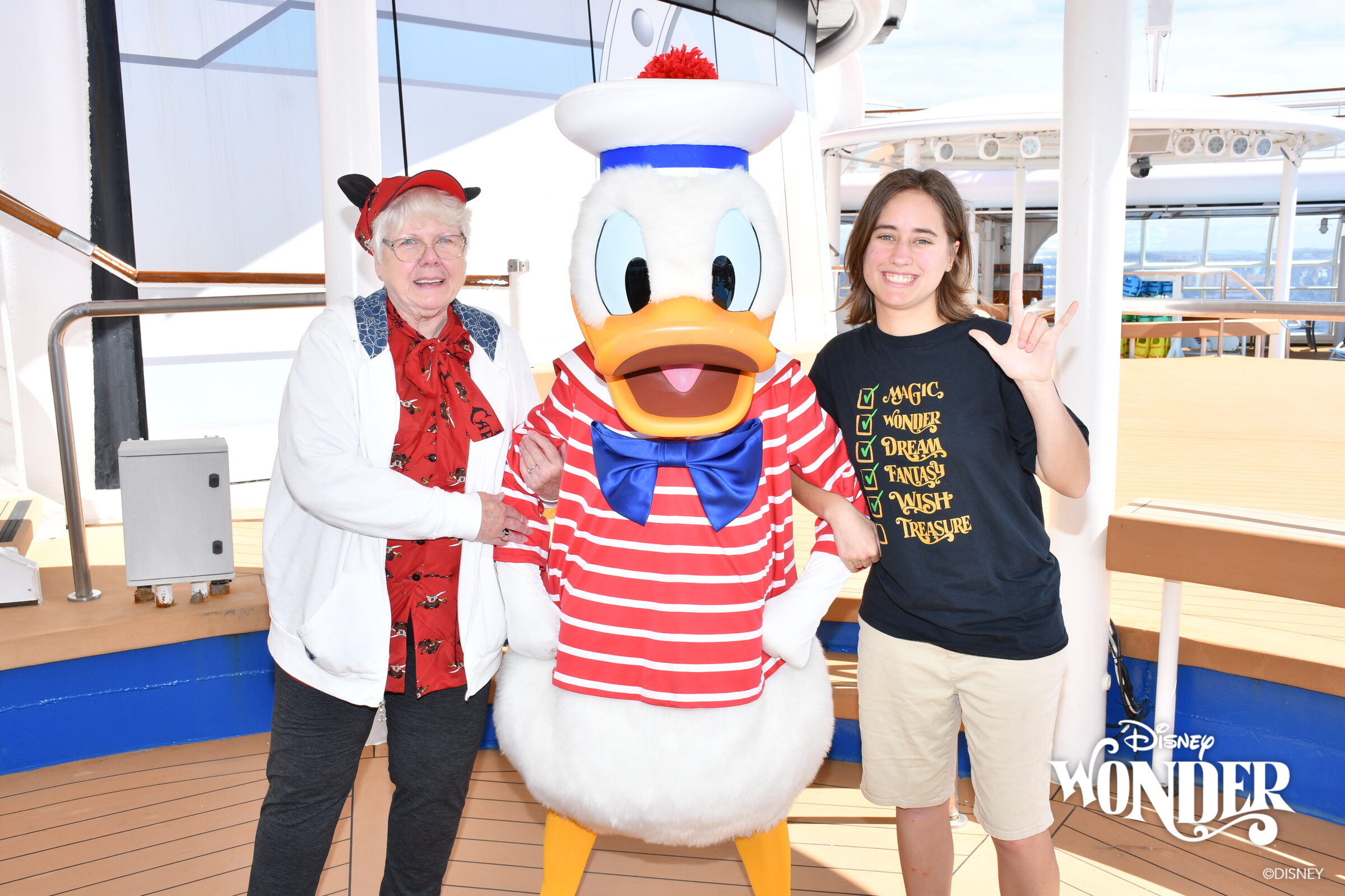 Donna, Donald in his red-striped sailor outfit & Lisa on deck