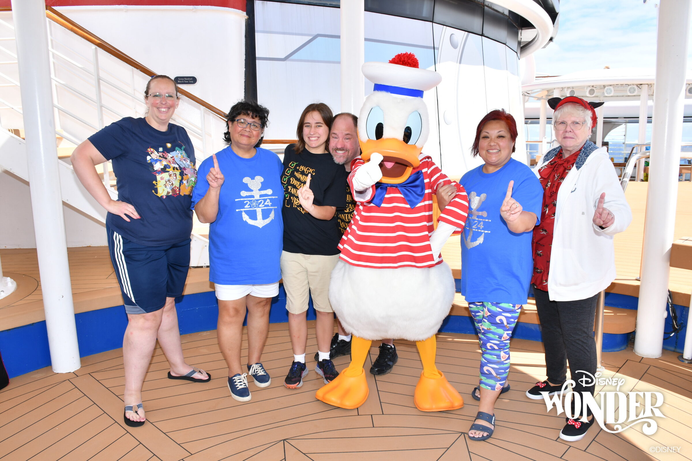 Lisa, Michael, Donald in his red-striped sailor outfit & Donna with friends on deck