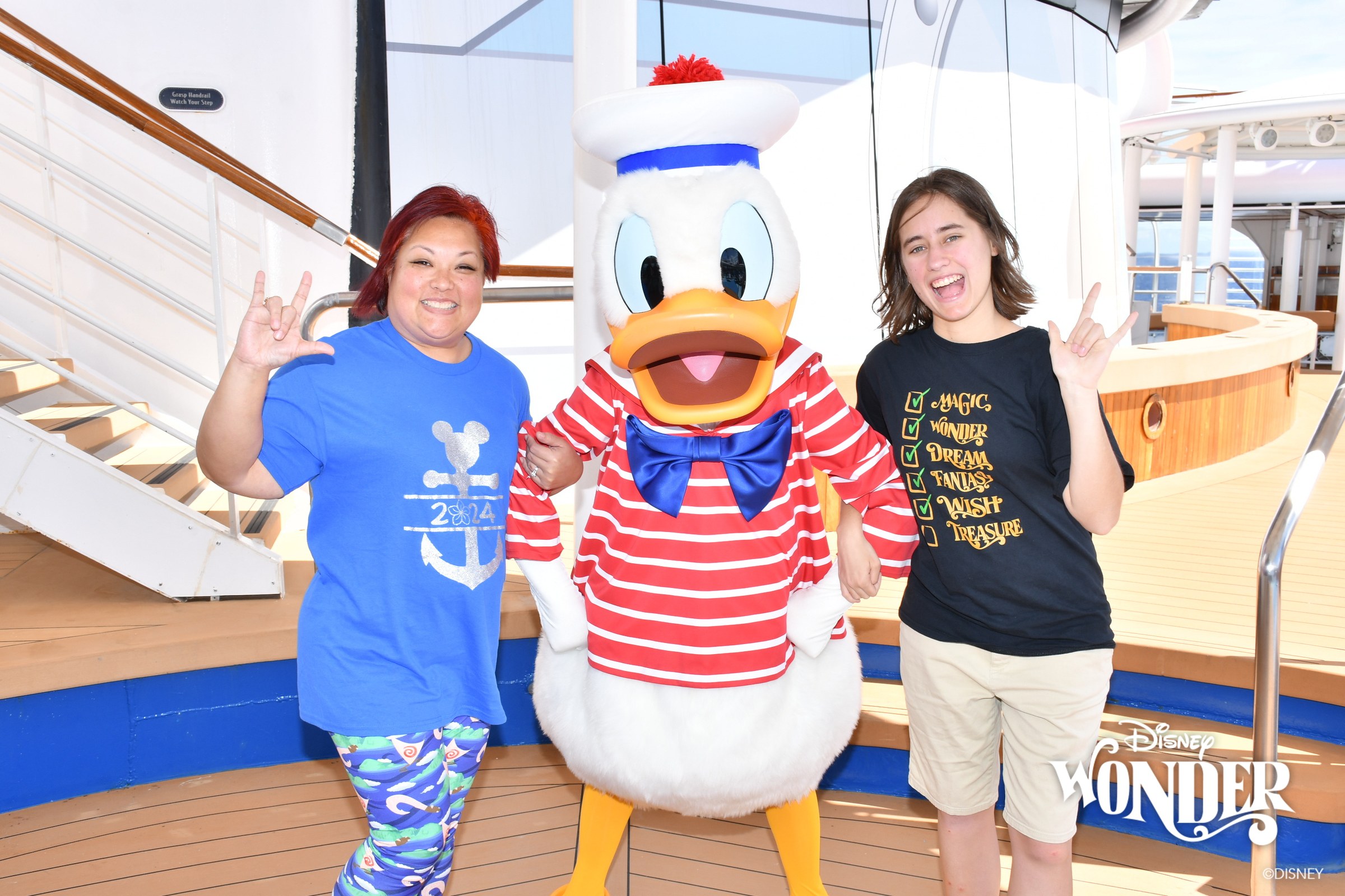 Donald in his red-striped sailor outfit & Lisa on deck