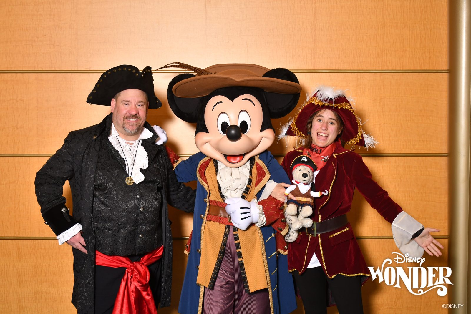 Michael, Mickey in pirate garb & Lisa at Pirate Night, Bob along too