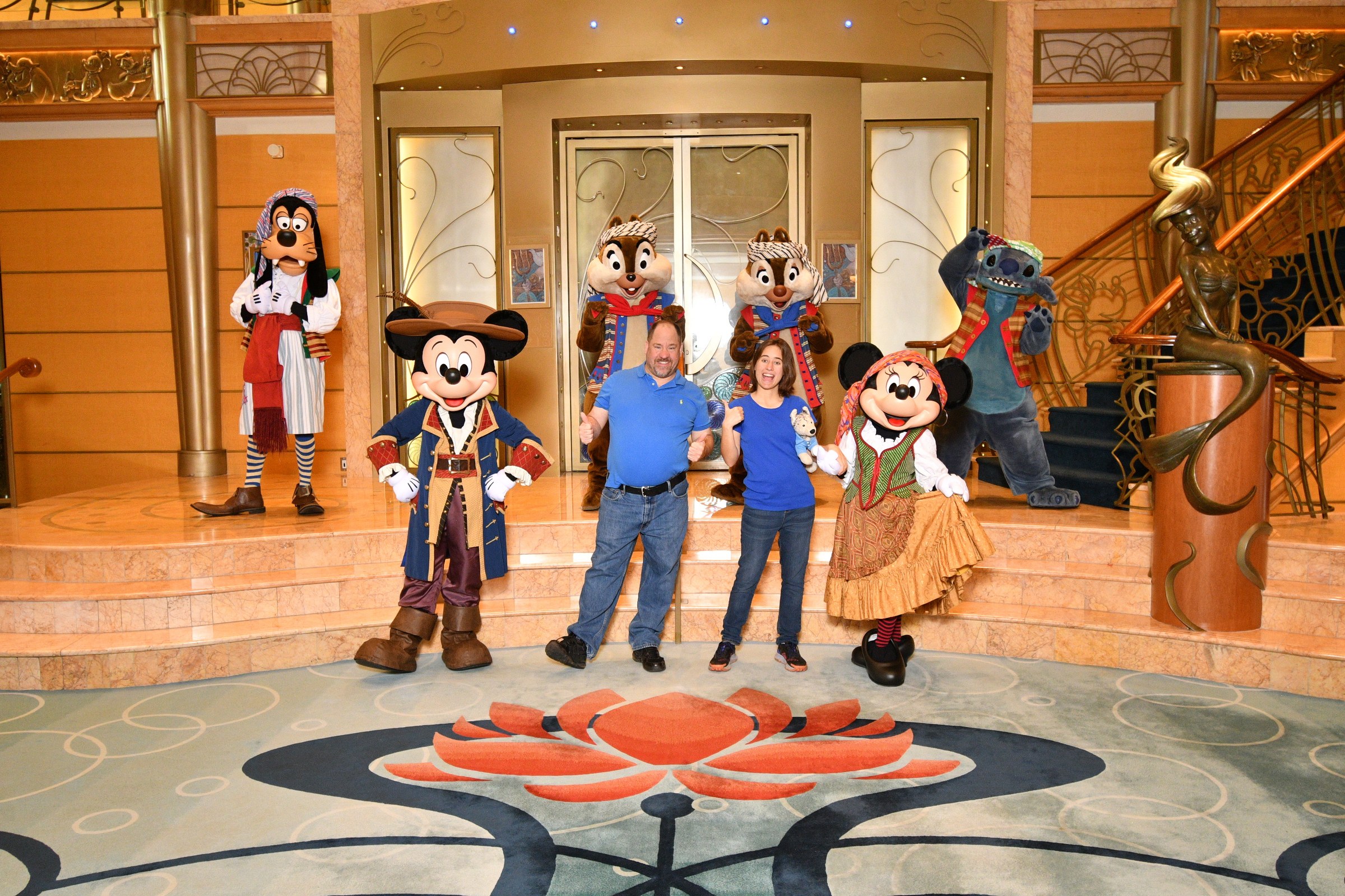 Goofy, Mickey, Chip, Michael, Lisa, Dale, Minnie & Stitch in pirate garb in the Lobby Atrium