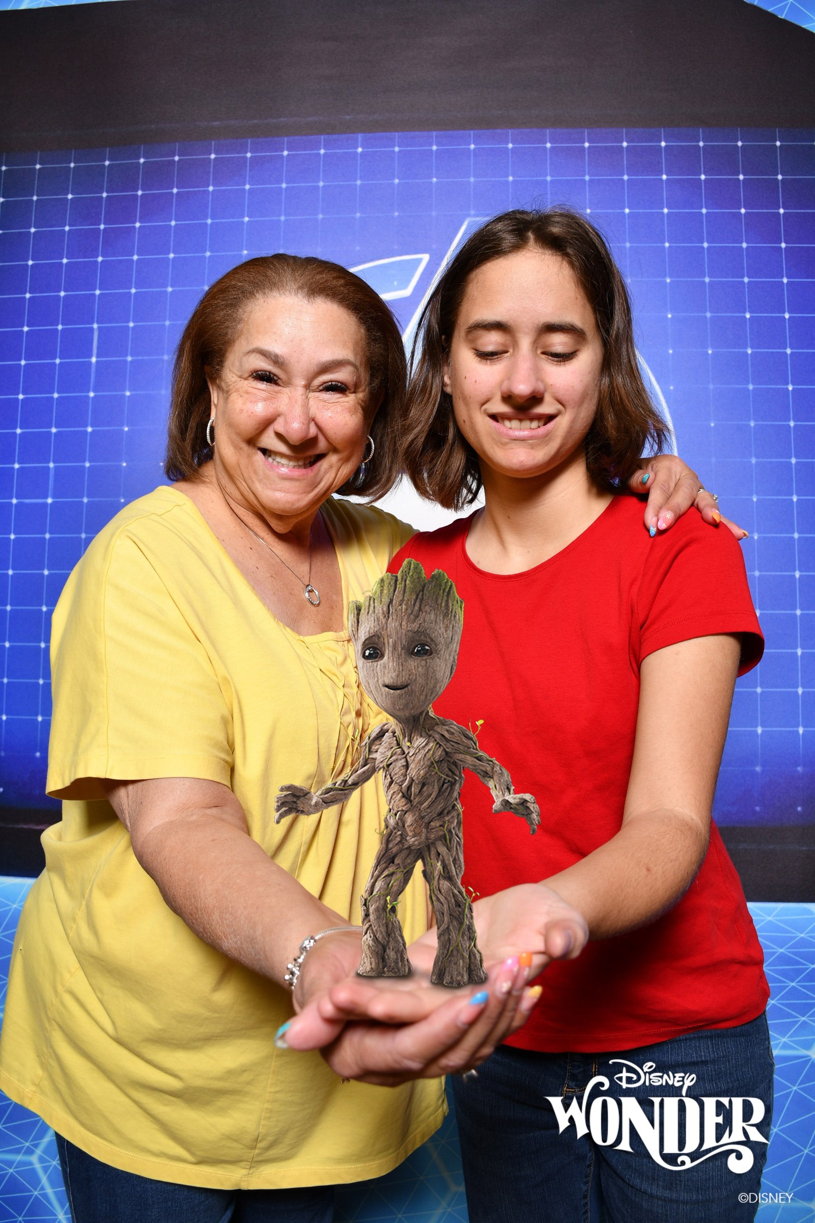 Lisa and a friend holding a Magic Shot Groot
