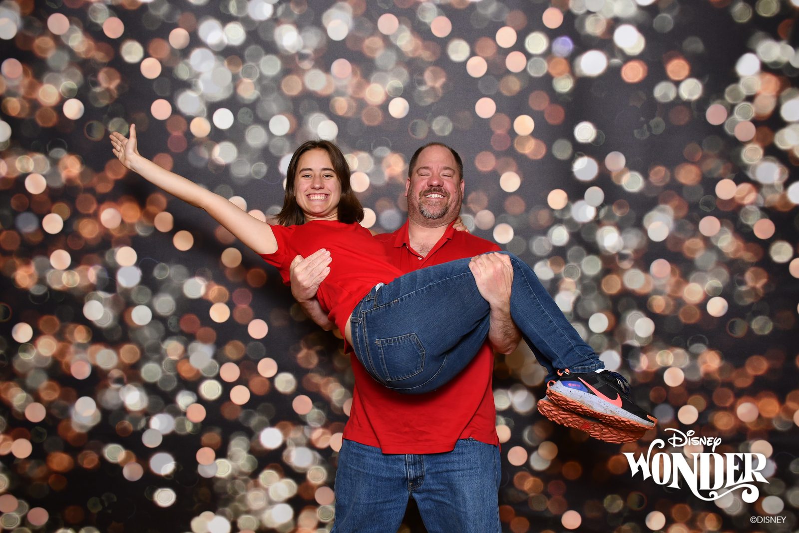 Michael gives Lisa a lift for a goofy photo