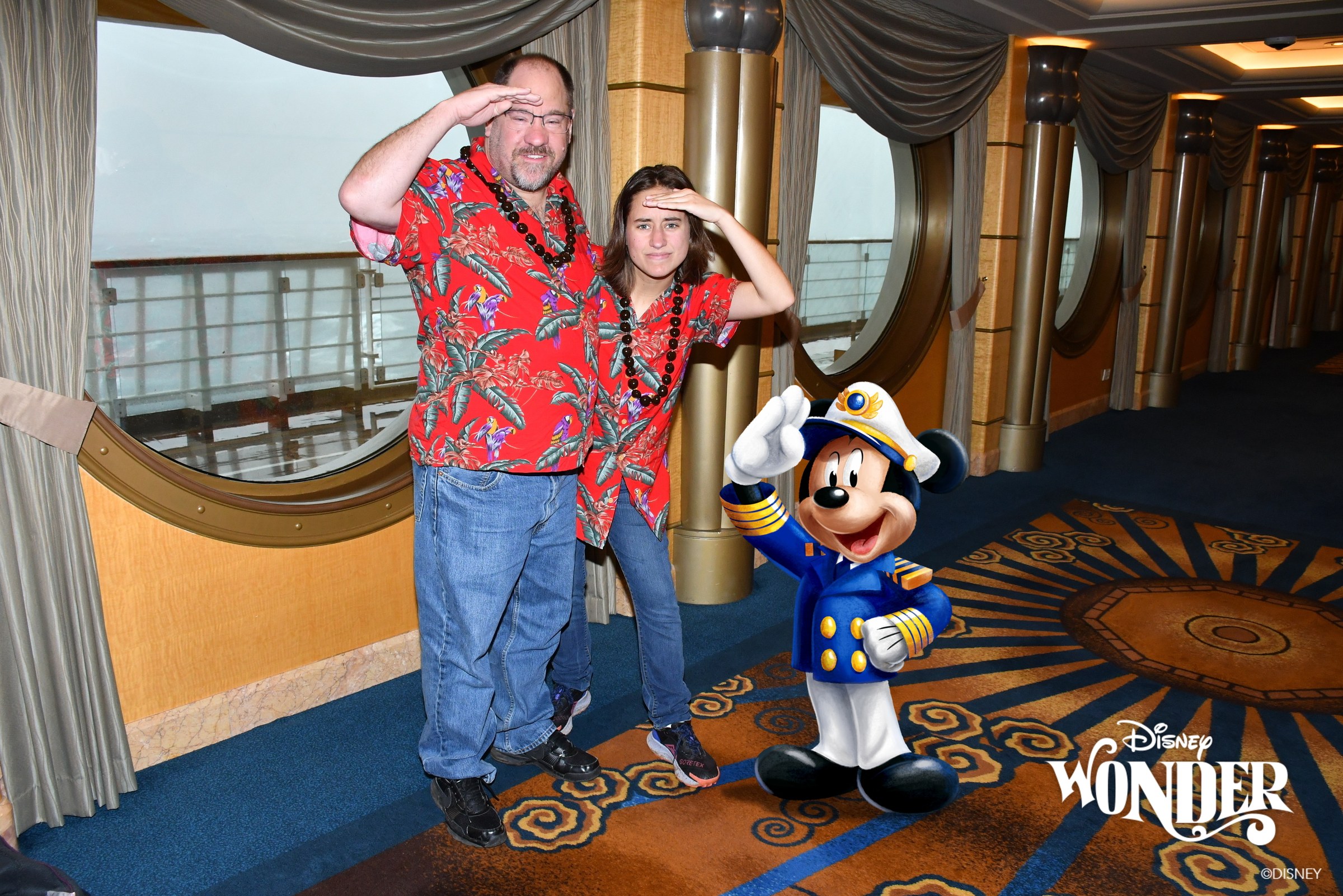 Lisa and Michael saluting a Magic Shot Captain Mickey in the porthole hallway