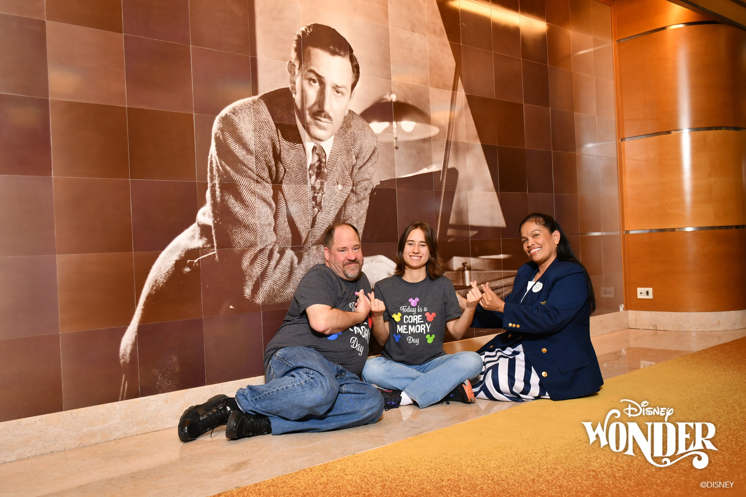 Lisa and Michael with one of the ship's officers at the Walt Disney mural