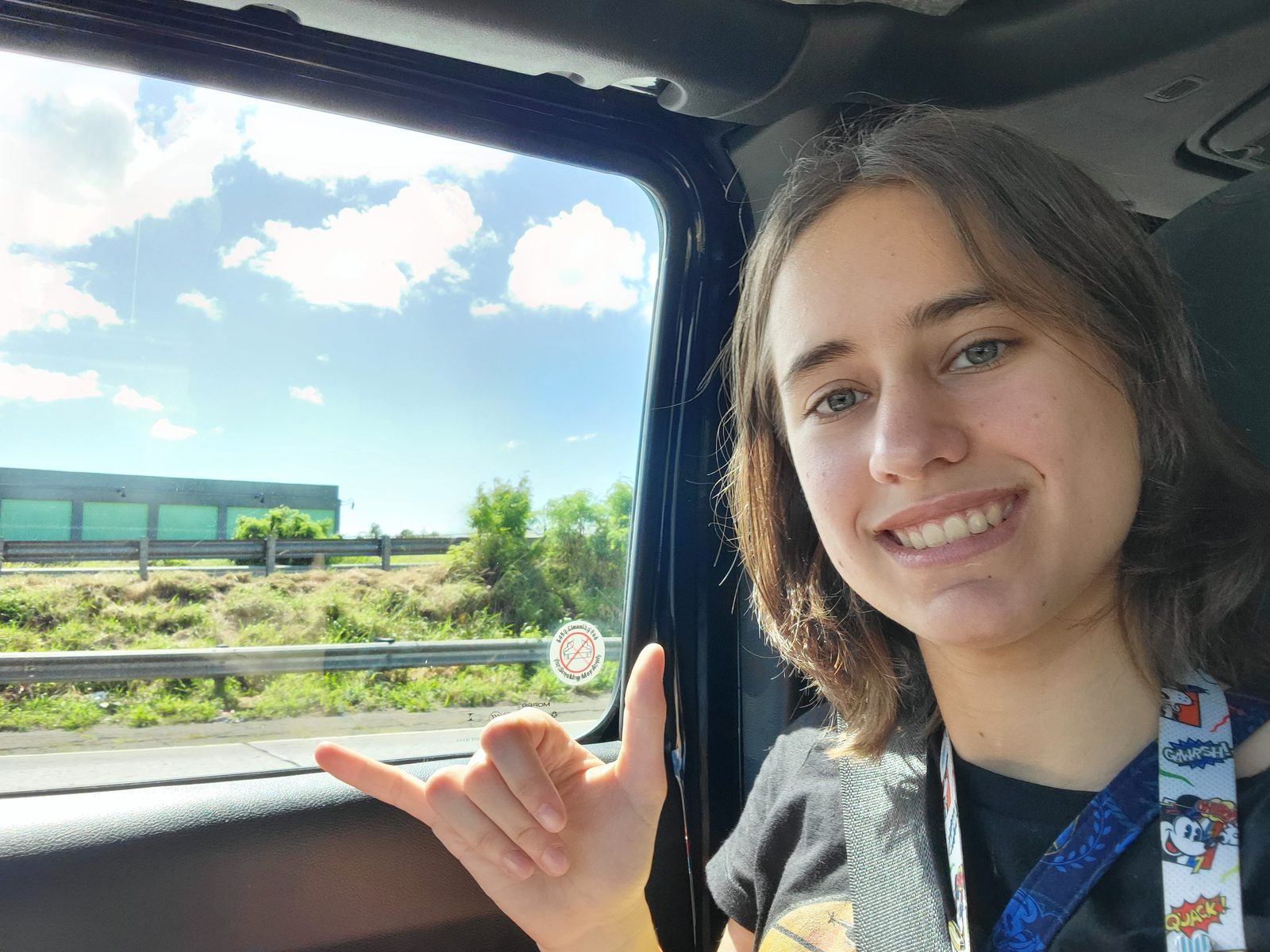 Lisa's shaka sign on the ride to the pier